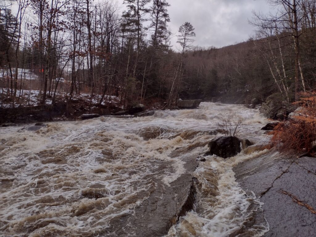 The New Haven Ledges above the route 116 bridge raging from a storm on December 23rd 2022