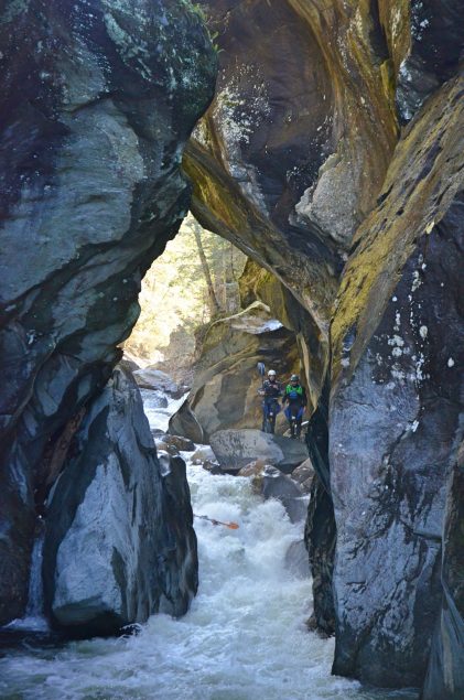 Whitewater kayakers running Rebirth Rapid Middlebury Gorge Vermont